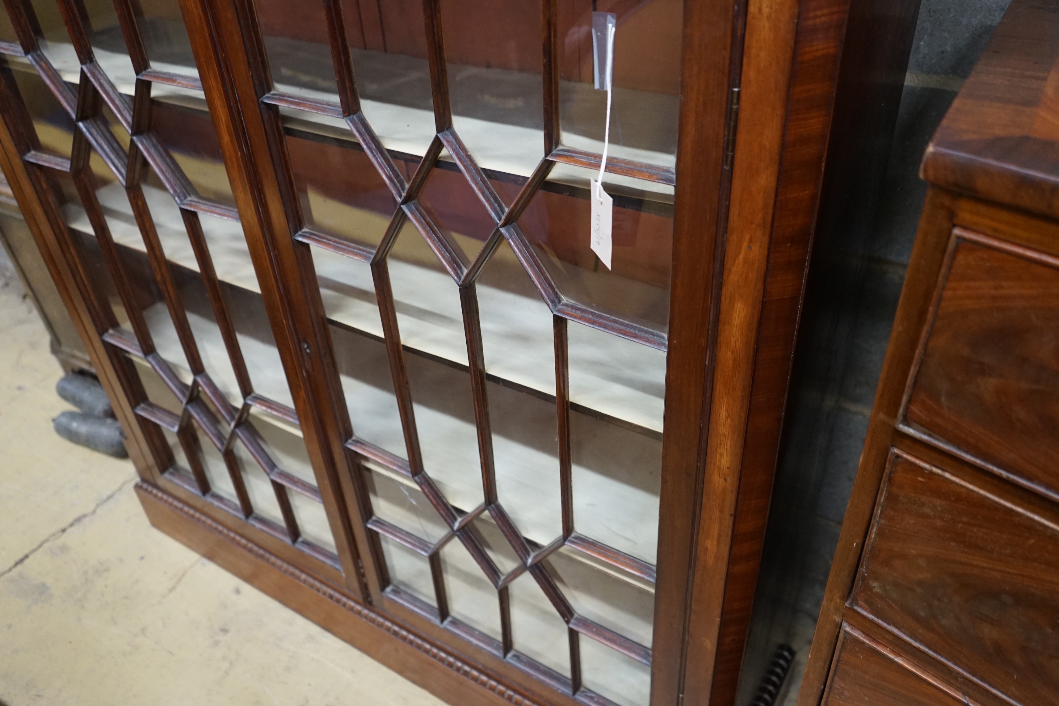 A George III and later mahogany bookcase (altered), length 128cm, depth 33cm, height 129cm